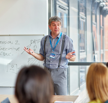 Lecturer talking to room of students