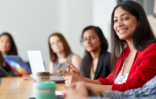 Women around a board table