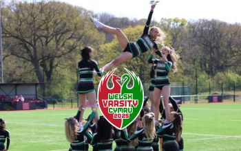 Varsity cheerleaders in their halftime performance